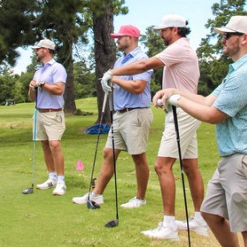 Jack Apparel men's golf polos - four golfers on the course