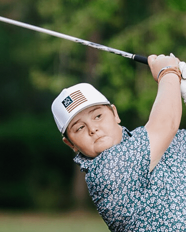 Kid wearing the Lil Jack Gusta golf polo on the course – Jack Apparel