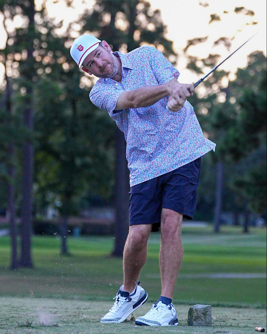 The Patriot Blue men's golf polo on course - Jack Apparel