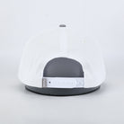 White cap with gray brim on a white background